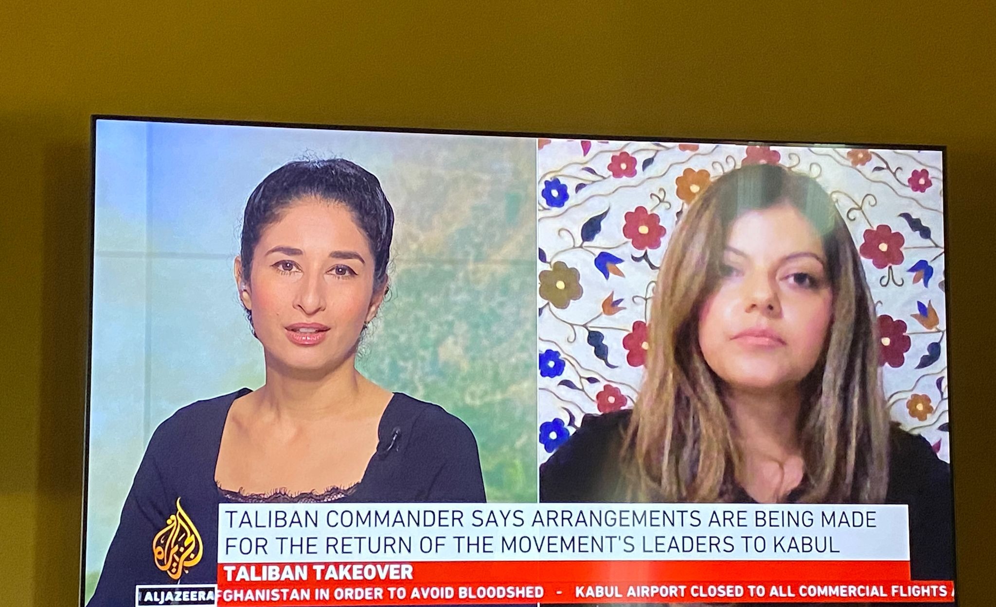 Mina Sharif in conversation with a news anchor during live television coverage