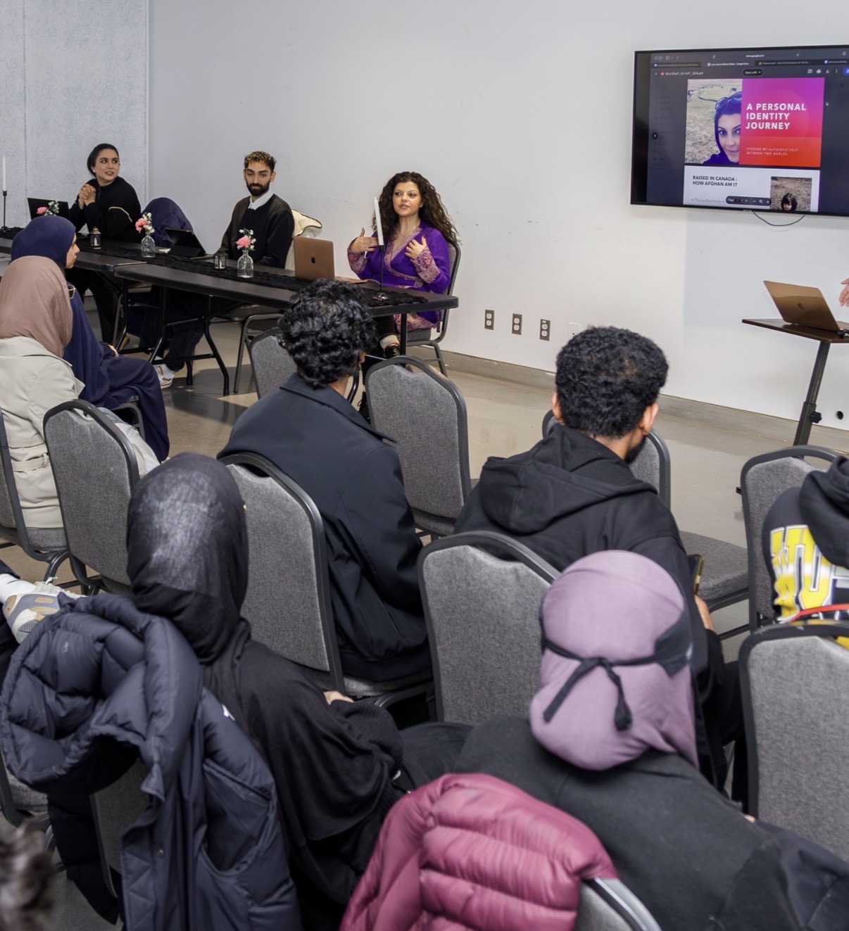 Mina Sharif presenting A Personal Identity Journey to a workshop audience